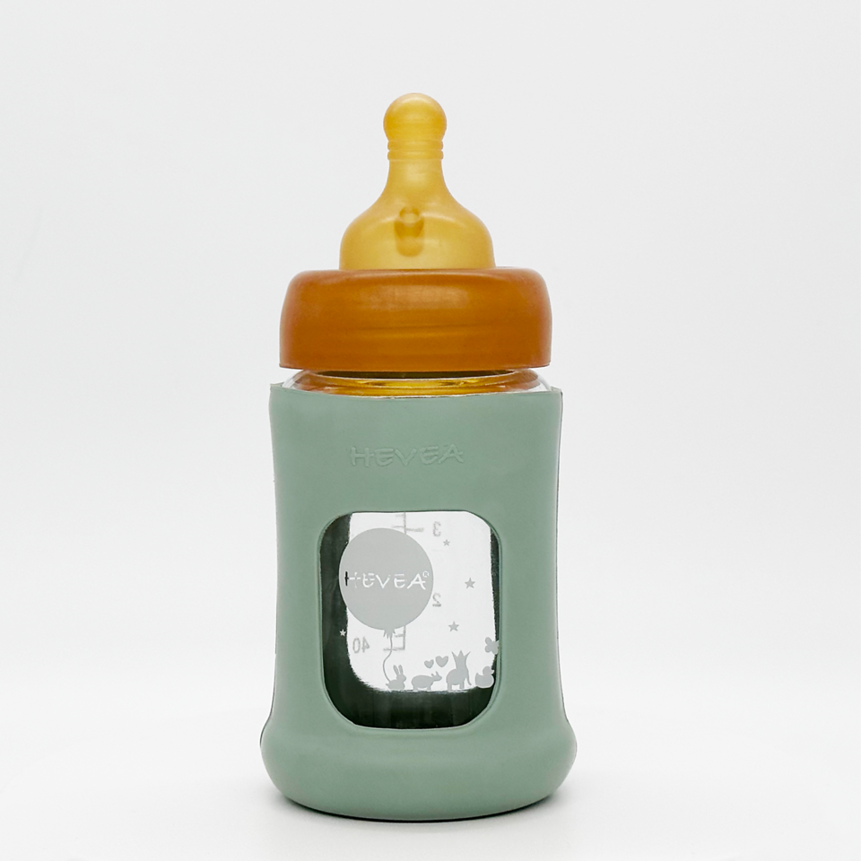 Hevea baby glass bottle with wide opening and protective sleeve.