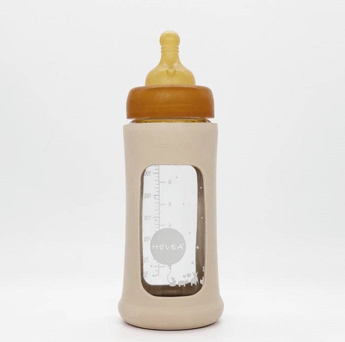 Hevea baby glass bottle with wide opening and protective sleeve.