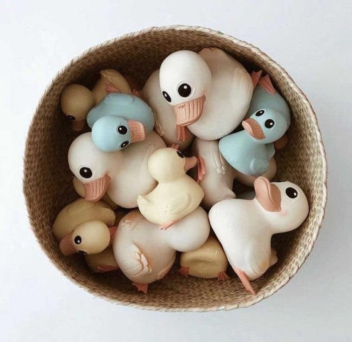 Basket of Hevea Kawan Mini rubber ducks in various pastel colors.