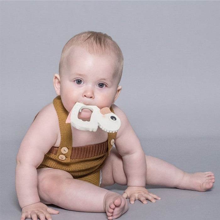 Baby using Hevea Kawan teething gift set made from natural rubber.