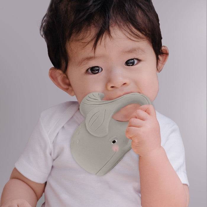 Baby using Hevea Bumibebe teether made of natural rubber.