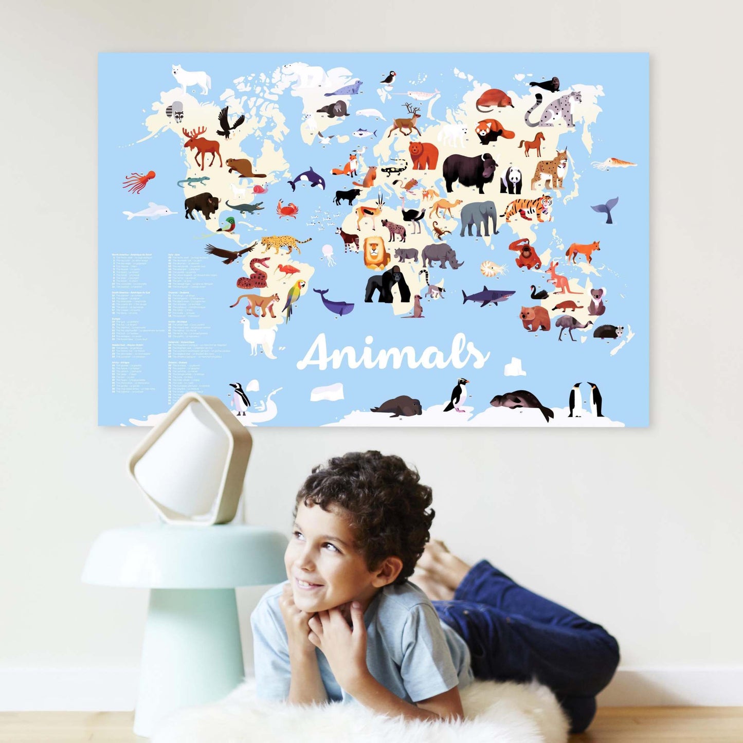 Educational animal discovery poster with 67 repositionable stickers, featuring a world map for kids in English and French by Olivier Latyk.
