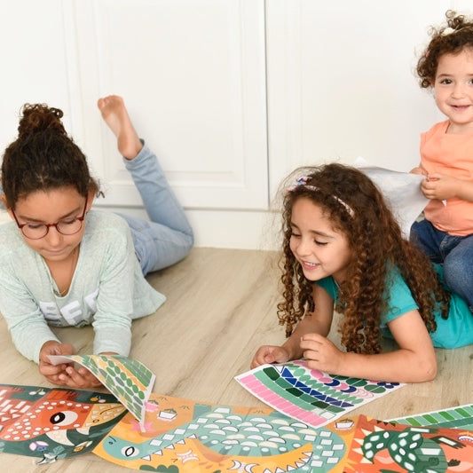 Children enjoying Poppik Panorama Dinosaur Sticker Activity 3+, enhancing creativity and motor skills.