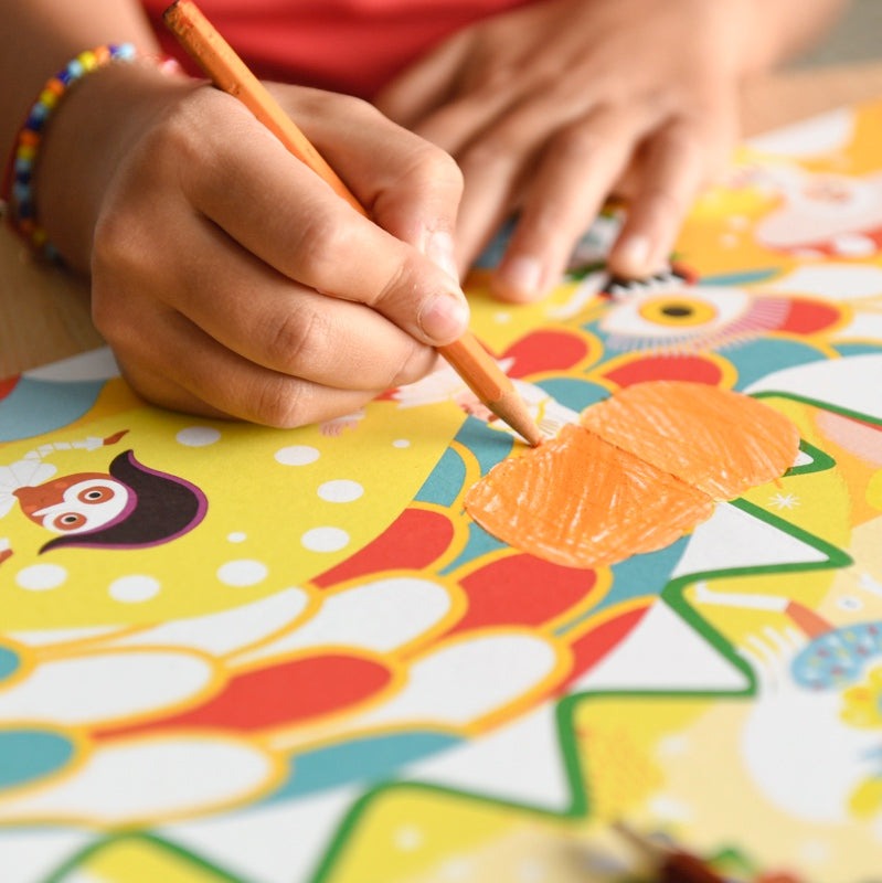 Child coloring Poppik poster with vibrant carnival theme.