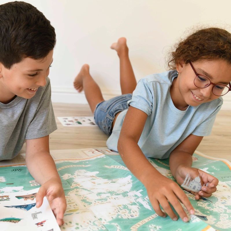 Children playing with educational world monuments sticker poster.
