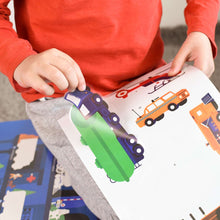 Child placing vehicle stickers on Poppik educational poster.